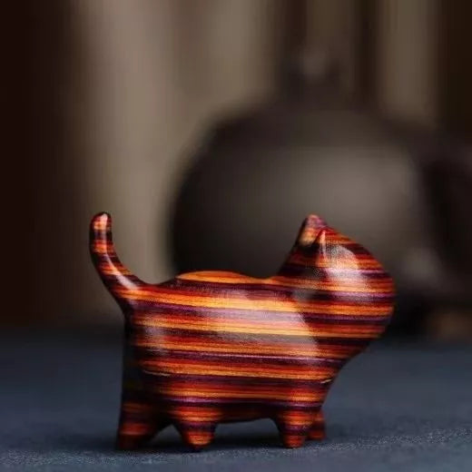 Handmade green sandalwood kitten ornament with unique design