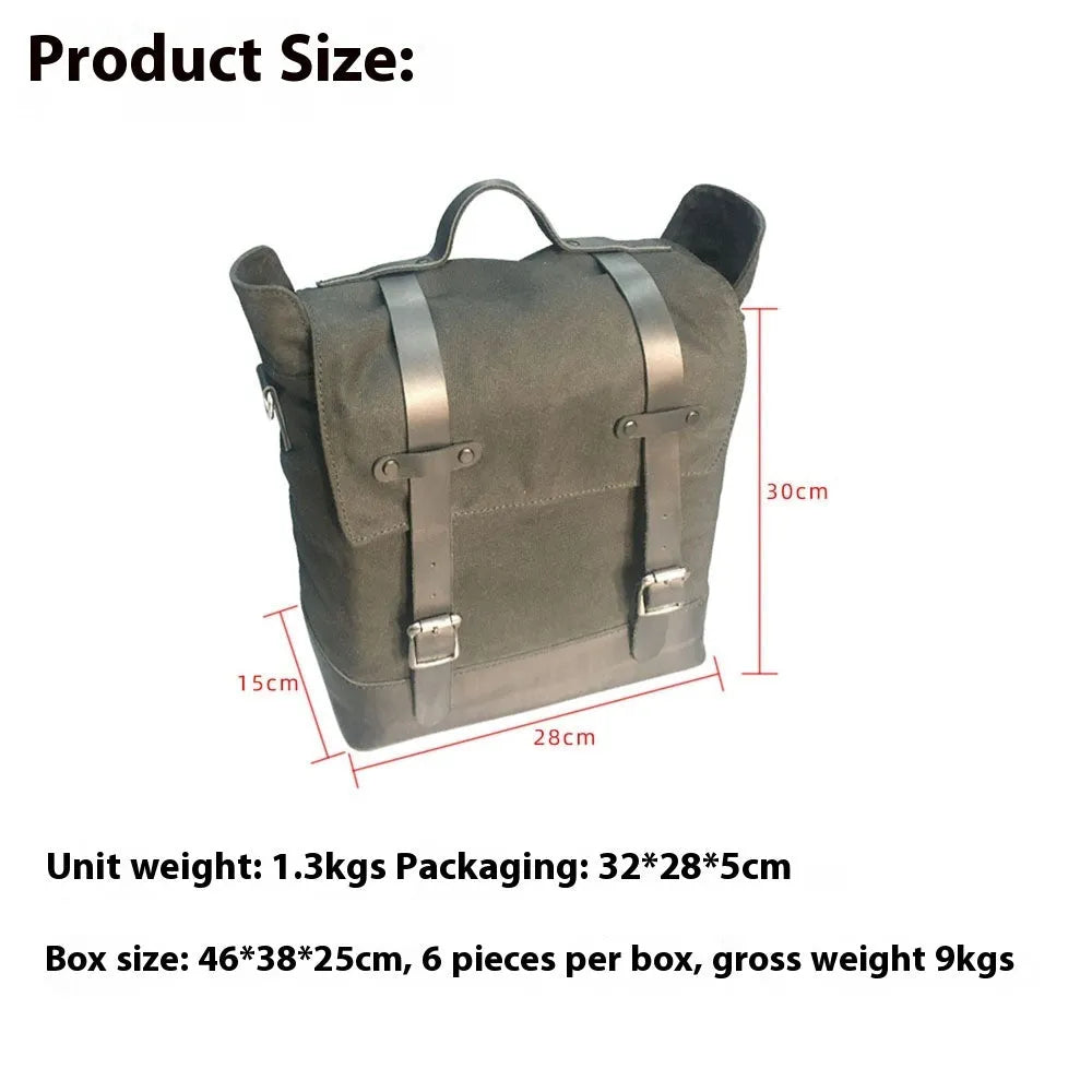 Black waterproof canvas motorcycle side bag with cowhide accents showing mounting straps