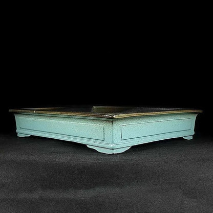 Green ceramic bonsai pot with purple sand crackled glaze finish, 15cm diameter plant container on wooden surface