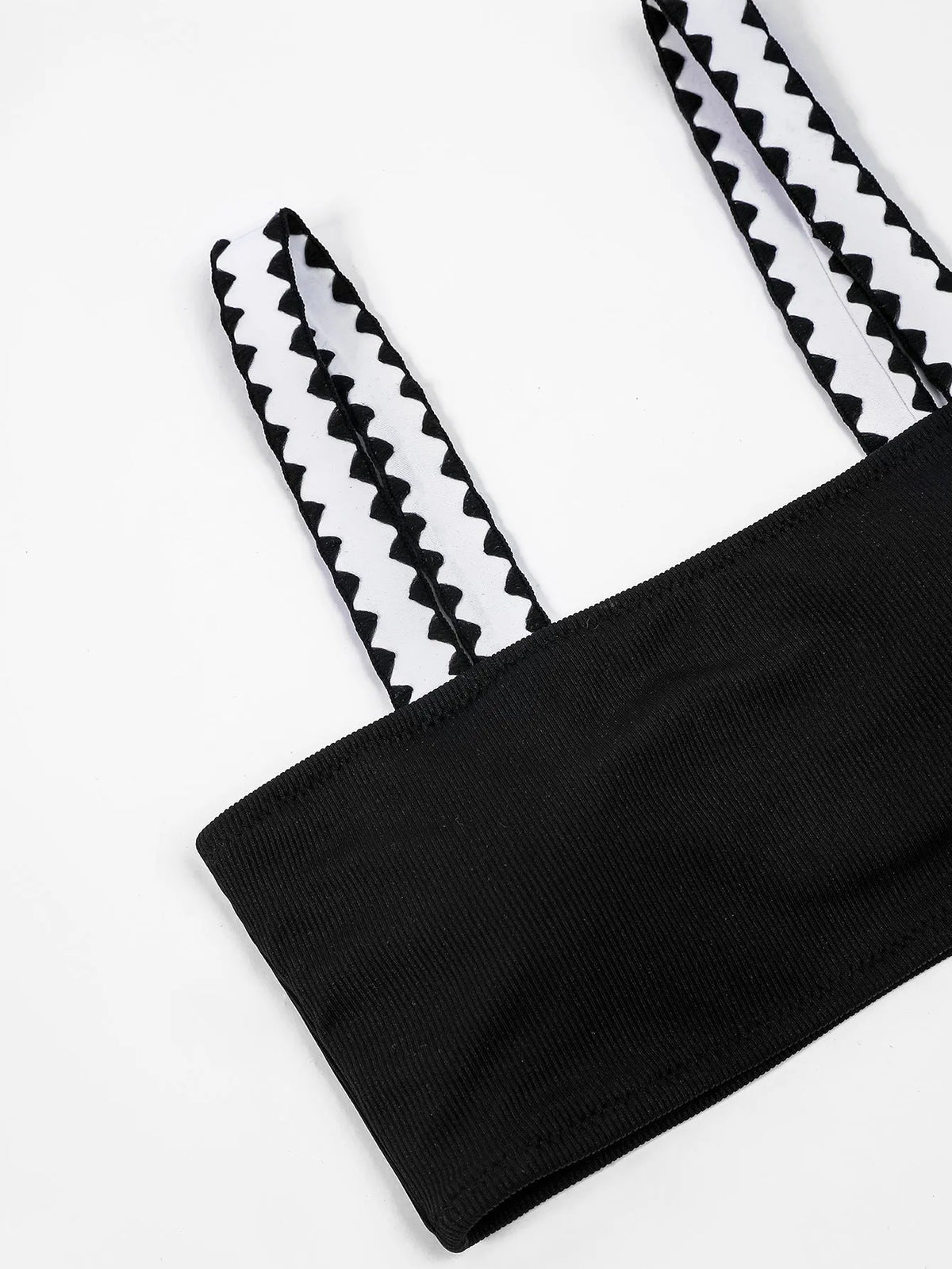 Black hollowed-out split briefs swimsuit for women made from polyester fabric