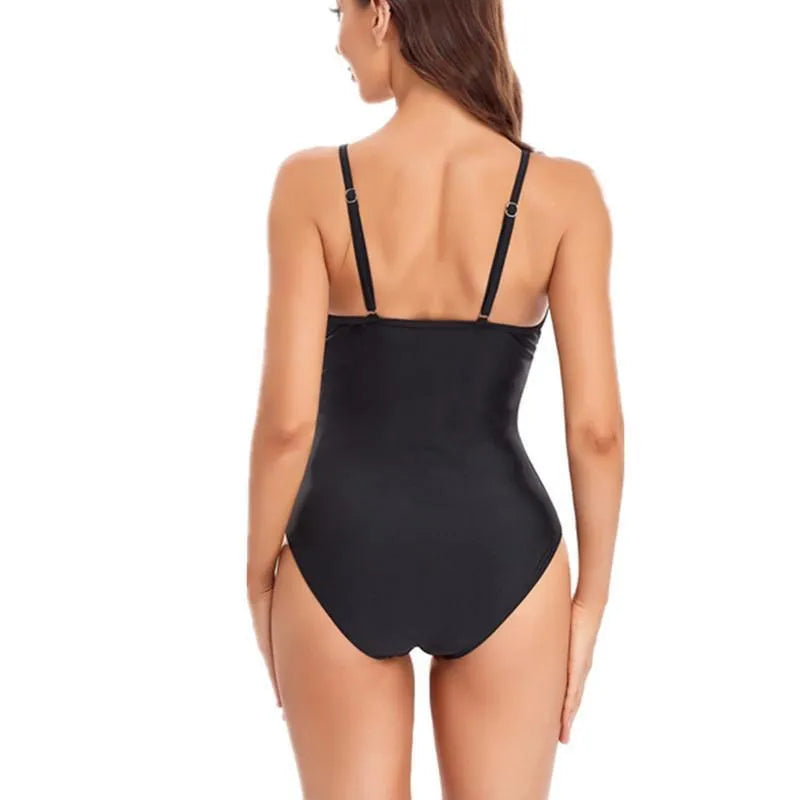 Ladies solid colour mesh one-piece swimsuit with a backless design.