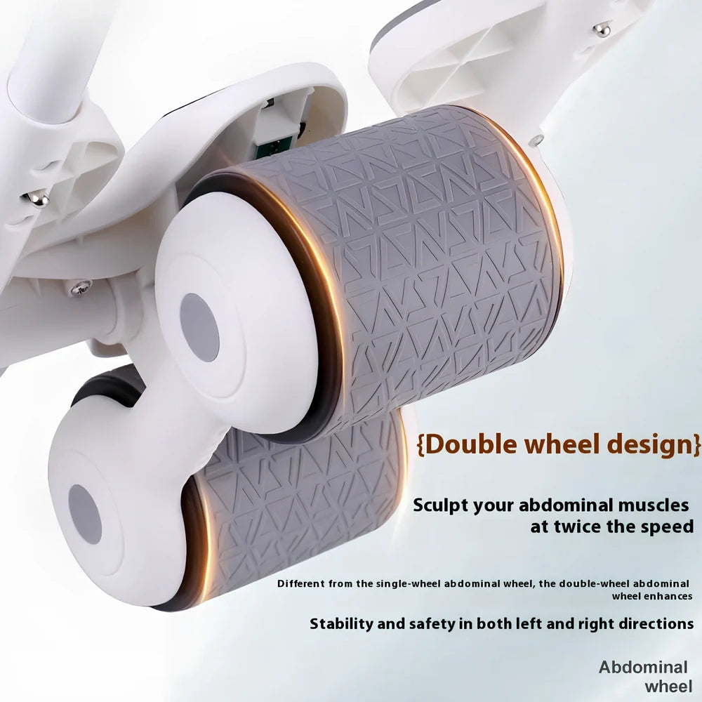 Black abdominal exercise wheel with four elbow support pads on grey floor