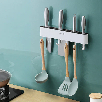 Sleek wall-mounted knife organizer with slots for knives and hooks for storing kitchen essentials