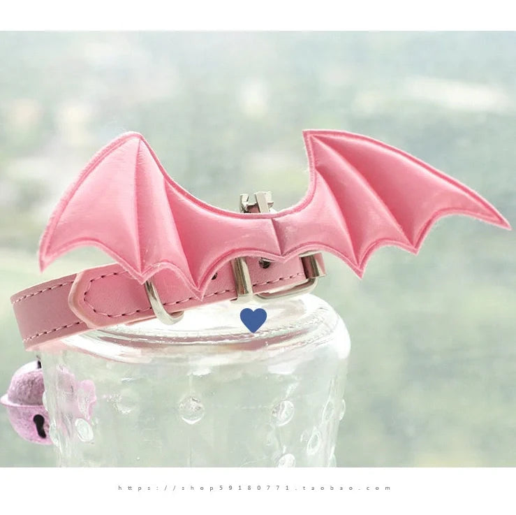 Black patent leather choker with 15cm wings decoration and bell attachment on adjustable 30-40cm collar