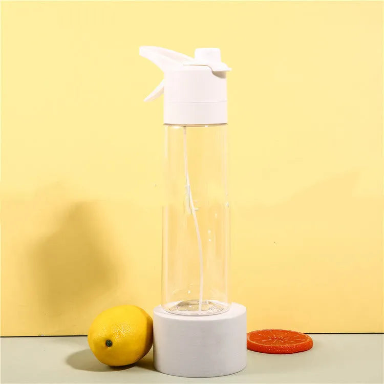 Large plastic spray water bottle with handle strap and leakproof lid in green colour.