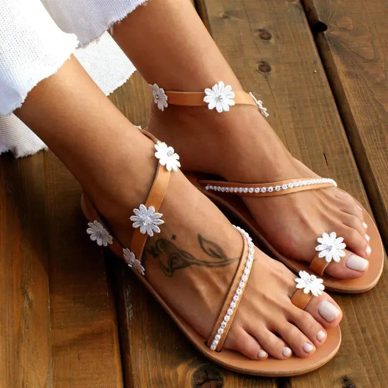 Brown women's Roman sandals with floral pattern, herringbone toe design, artificial PU upper and rubber sole