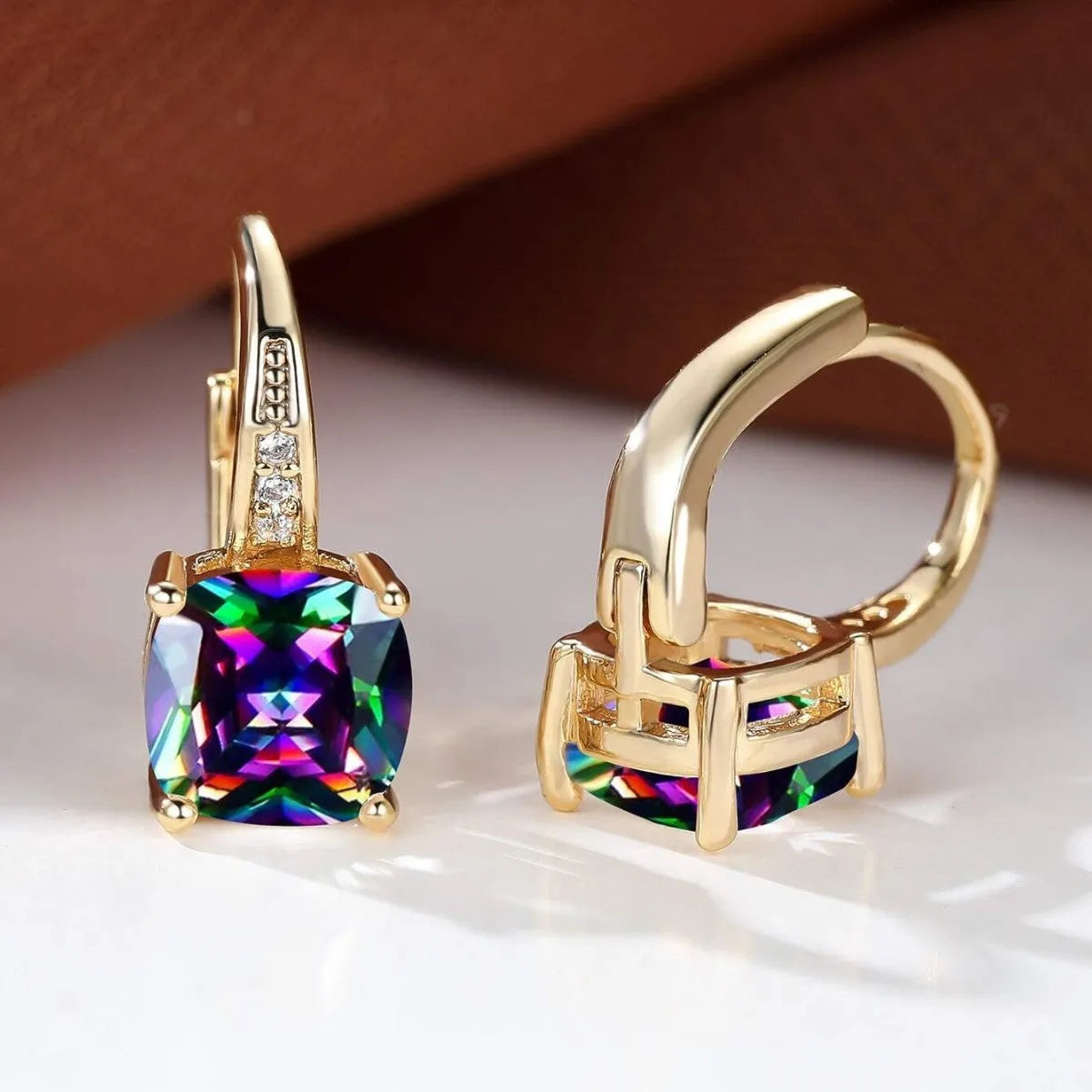 Square geometric ear clips with colourful moissanite inlays and a metallic electroplated finish.