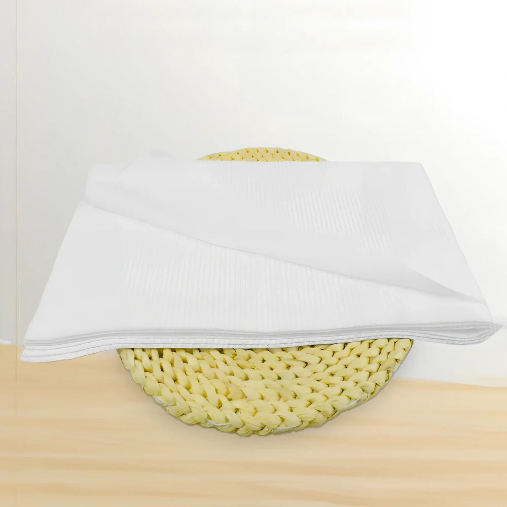 Pack of non-woven disposable bath towels 65x135cm with pearl pattern for absorbent drying