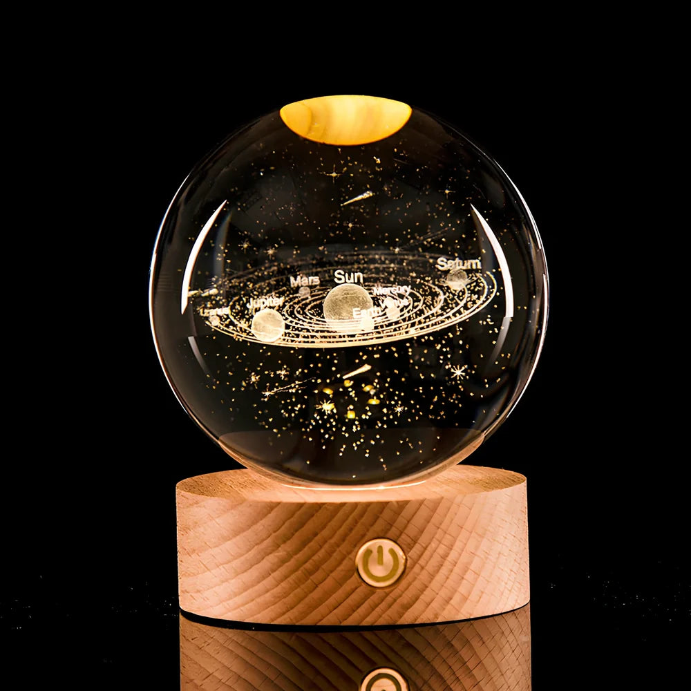 Transparent crystal ball with 3D laser inner carving of galaxy patterns on charging base
