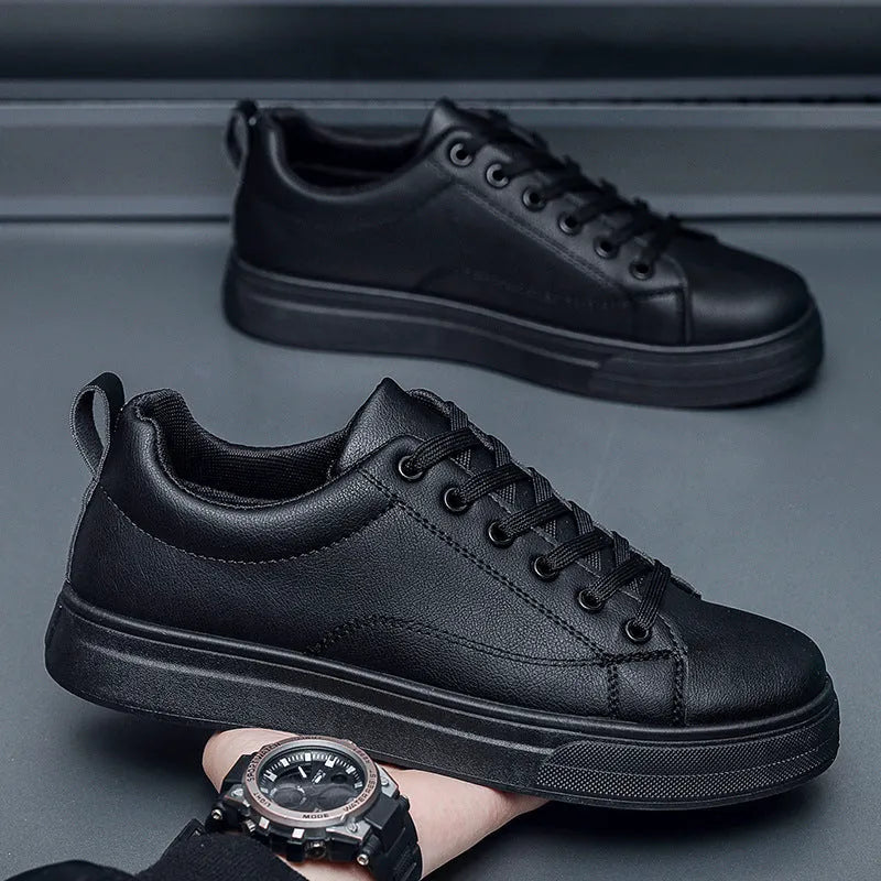 Men's low top casual sneakers in Korean style, shown in black, white, and two-tone colour options on a rubber sole.