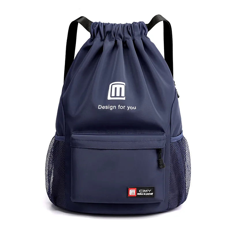 Large bucket-shaped travel backpack in blue with drawstring closure and soft black shoulder straps.