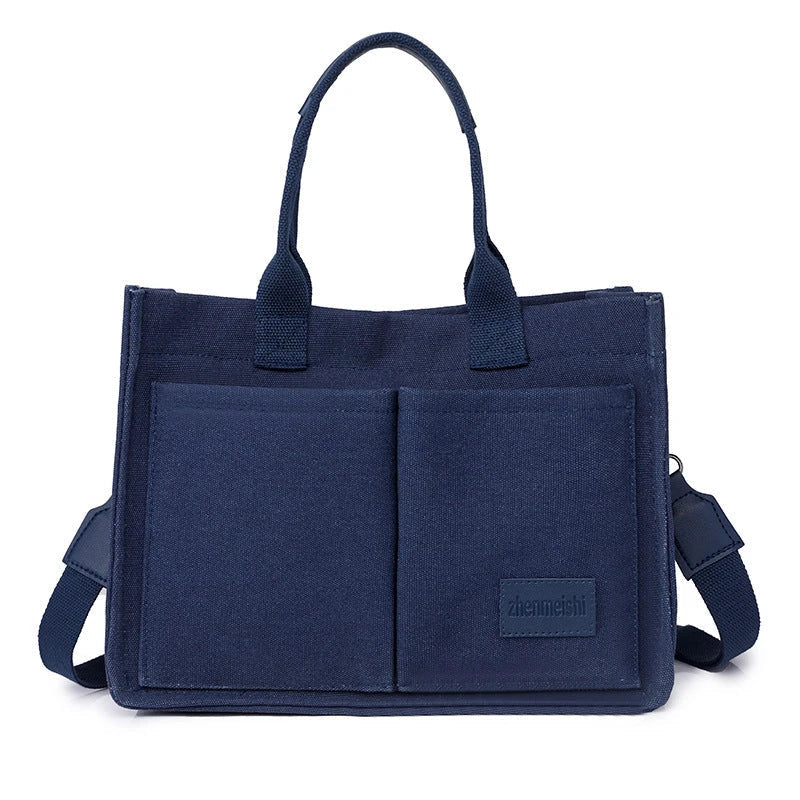 Premium canvas tote bag in multiple colors with adjustable shoulder strap and organizational pockets