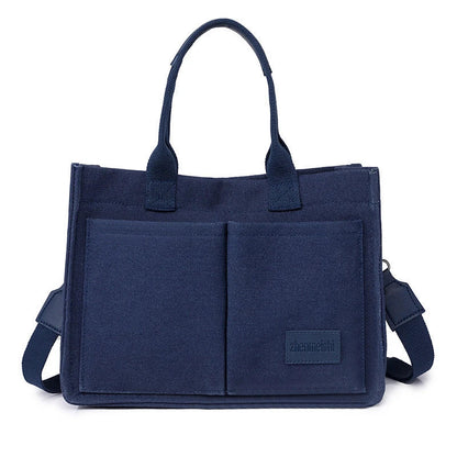 Premium canvas tote bag in multiple colors with adjustable shoulder strap and organizational pockets