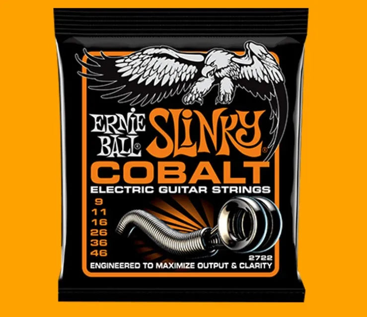 Coils of nickel-plated electric guitar strings and bass strings showing their metallic shine.