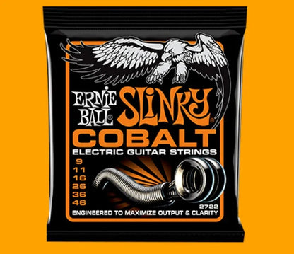 Coils of nickel-plated electric guitar strings and bass strings showing their metallic shine.