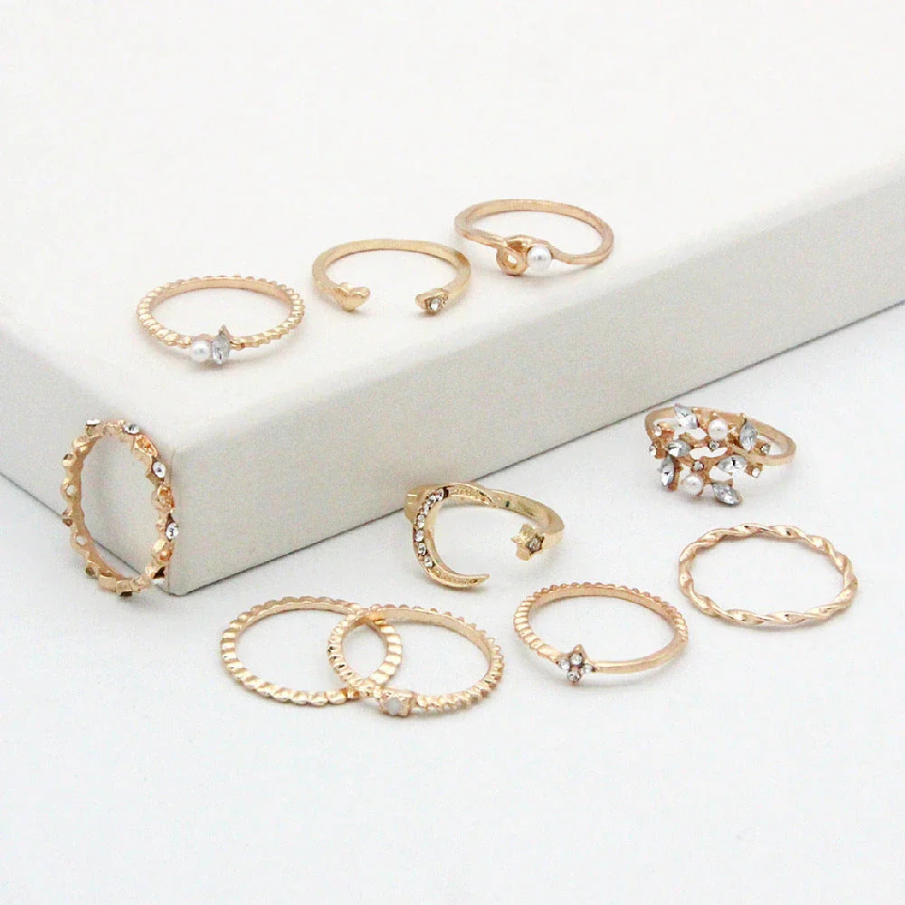 Enchanting gold-plated celestial-themed rings featuring stars, moons, and pearls