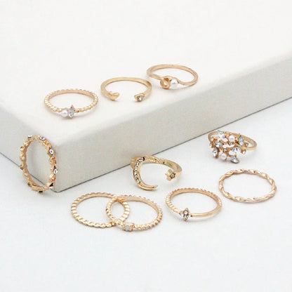 Enchanting gold-plated celestial-themed rings featuring stars, moons, and pearls