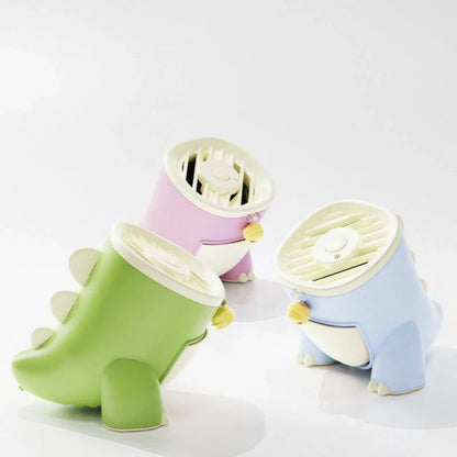 Dinosaur Mosquito Killing Lamp in pink, green, and blue options on a white background