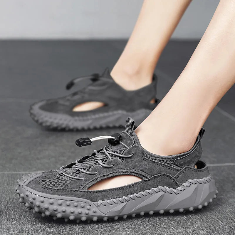 Men's black waterproof sports sandals with leather mesh upper, elastic band, and rubber sole.