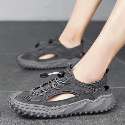 Men's black waterproof sports sandals with leather mesh upper, elastic band, and rubber sole.