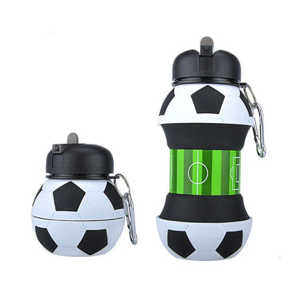 Collapsible soccer-shaped water bottle with straw, made of food-grade silicone for sports and travel hydration