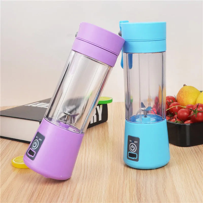 Pink portable USB electric fruit juicer blender cup with stainless steel blade and carry handle.