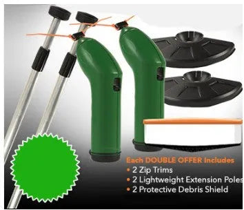 Cordless handheld lawn trimmer with green housing, extension pole, debris shield, and pack of zip ties on a garden lawn.
