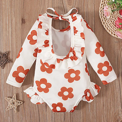 Girl's floral print swimsuit with crew neck and open back design in polyester fabric