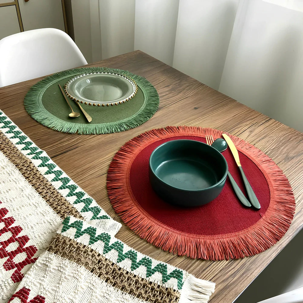 Round handwoven jute placemat with decorative tassels measuring 30cm diameter in Christmas green colour
