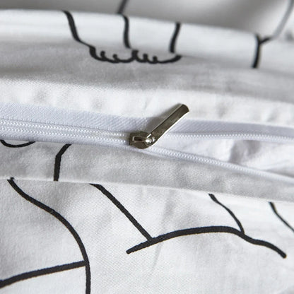 White cotton bedding set with active printed pattern, showing duvet cover, fitted sheet and pillowcases