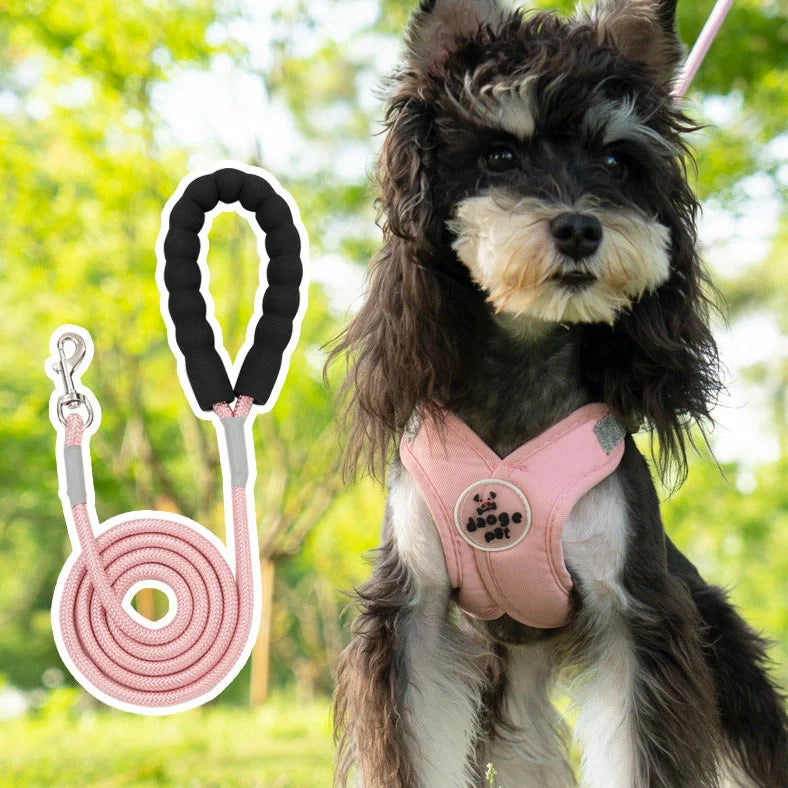 Adjustable pet vest with hand holding rope in blue, green, pink, or yellow colours