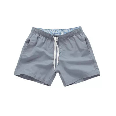 Men's summer surf shorts in various colors, made from 100% polyester for quick drying and durability