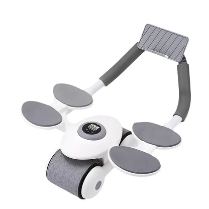 Black abdominal exercise wheel with four elbow support pads on grey floor