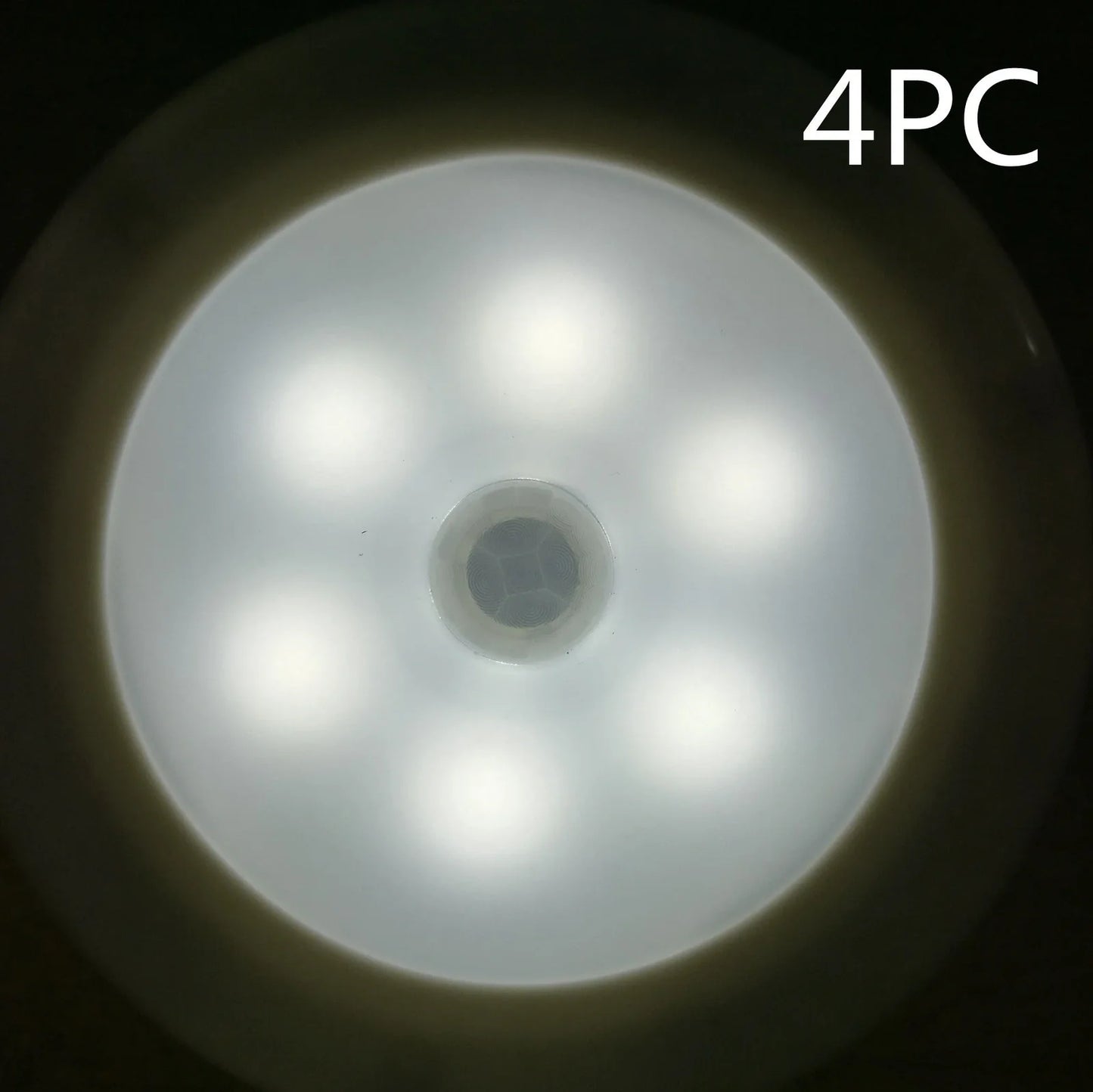 White motion-sensing LED cabinet lamp with magnetic back for wireless installation