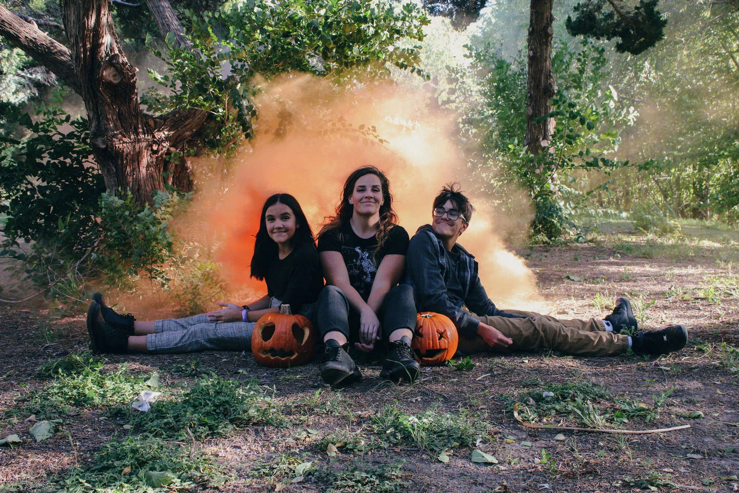 Vibrant colored smoke bombs creating a dramatic, captivating atmosphere for photography, events, and live performances.