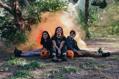 Vibrant colored smoke bombs creating a dramatic, captivating atmosphere for photography, events, and live performances.