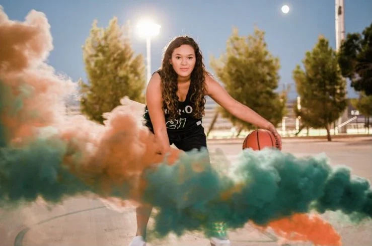 Vibrant colored smoke bombs creating a dramatic, captivating atmosphere for photography, events, and live performances.