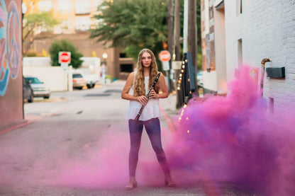Vibrant colored smoke bombs creating a dramatic, captivating atmosphere for photography, events, and live performances.