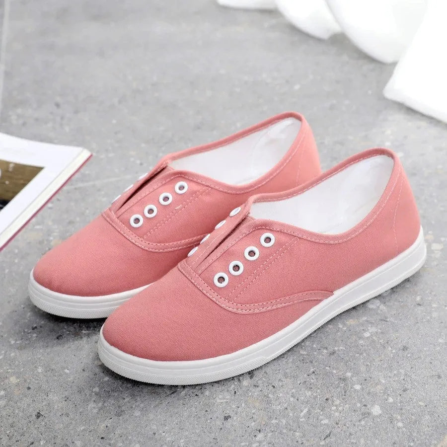 Low-top canvas casual shoes in various colours on a flat sole.