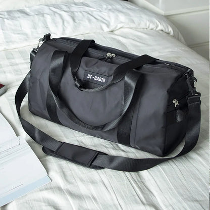 Beige casual sports bag with contrasting letter pattern and under 20L capacity