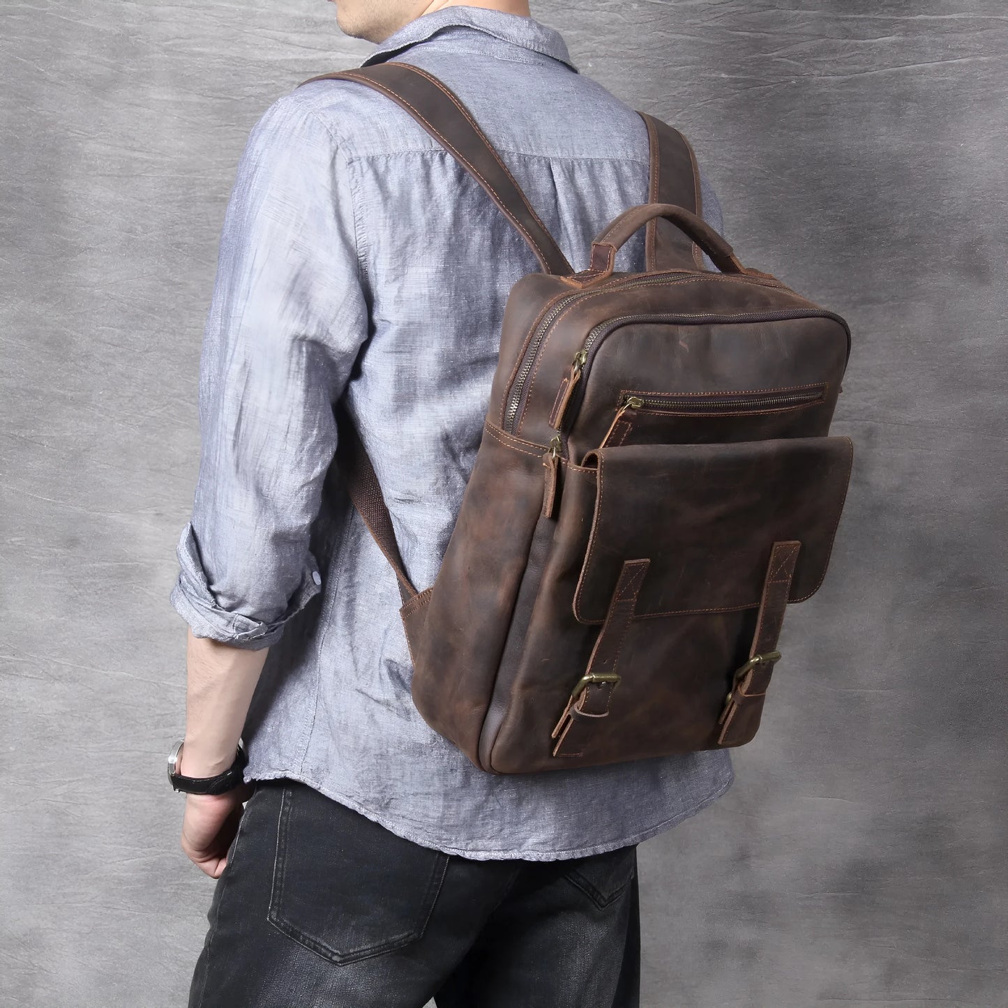 Dark coffee coloured retro leather backpack made from first layer cowhide with organised interior pockets.