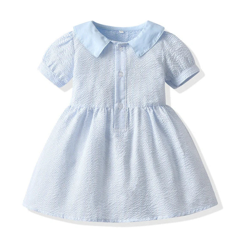 Girl wearing yellow plaid princess cotton dress with matching lace straw hat summer set