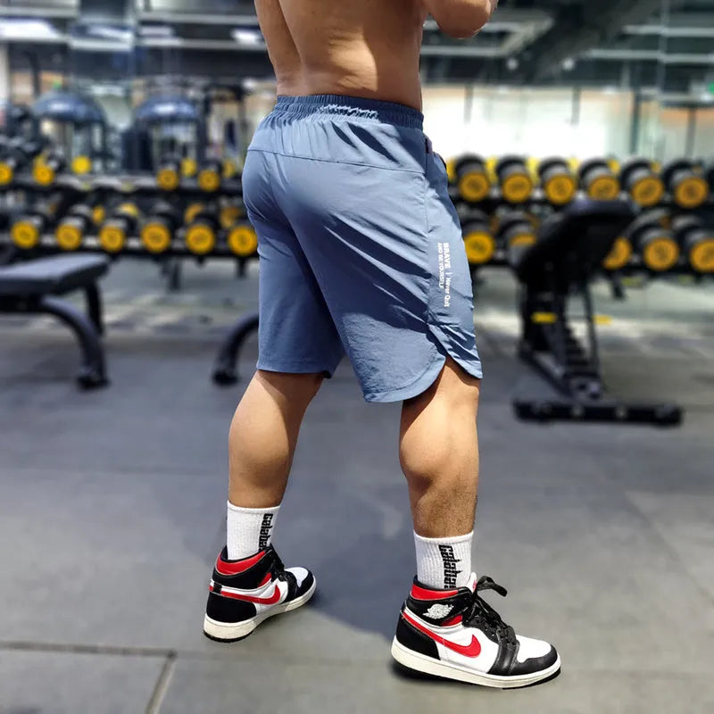 Men's thin quick-drying running shorts in black, blue, or grey, showing contrast colour detail.