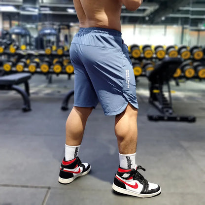 Men's thin quick-drying running shorts in black, blue, or grey, showing contrast colour detail.