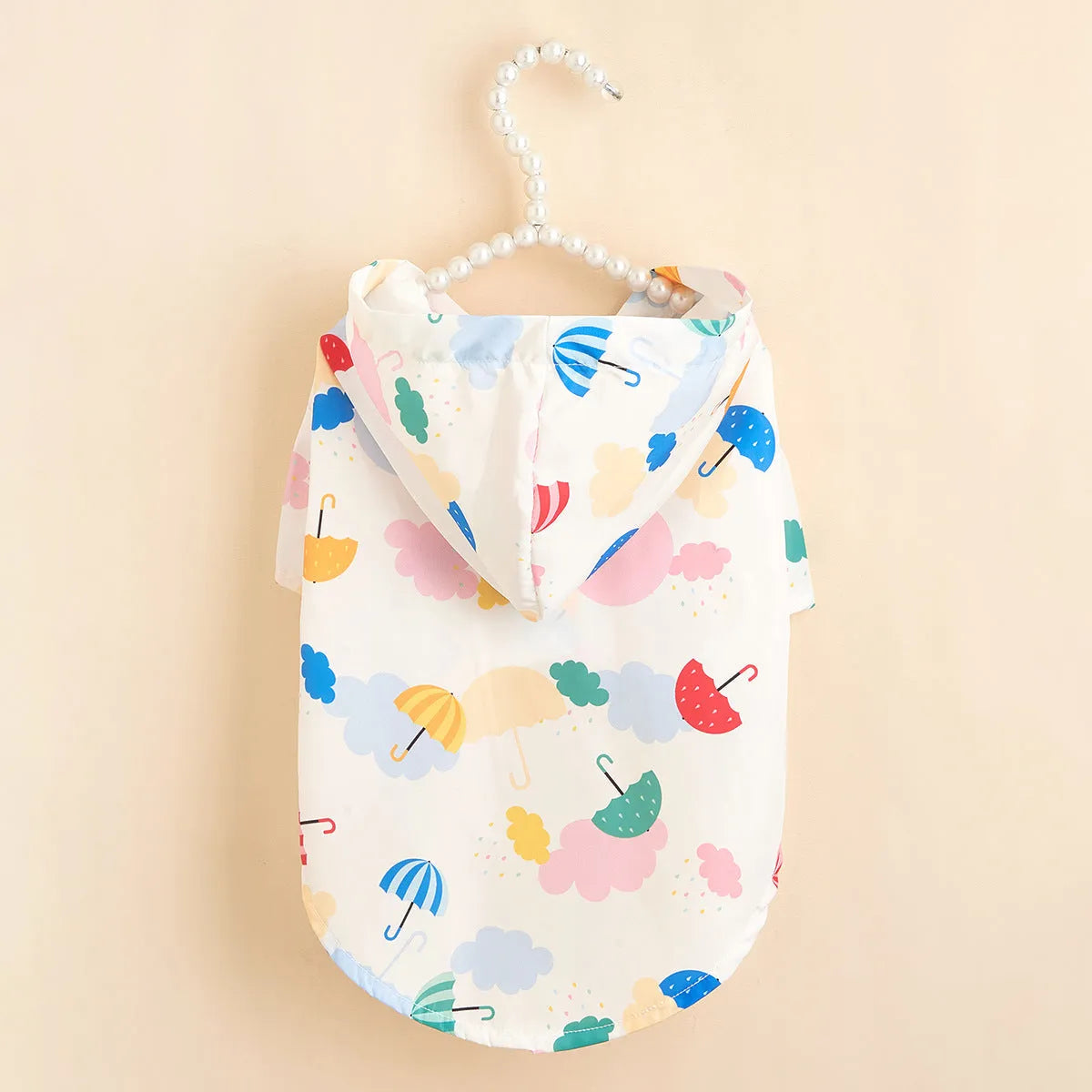 Colourful cartoon umbrella pattern pet raincoat for dogs and cats, shown in size L.