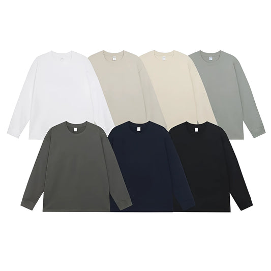 Man wearing a simple solid colour long sleeve cotton t-shirt in a loose, casual fit.