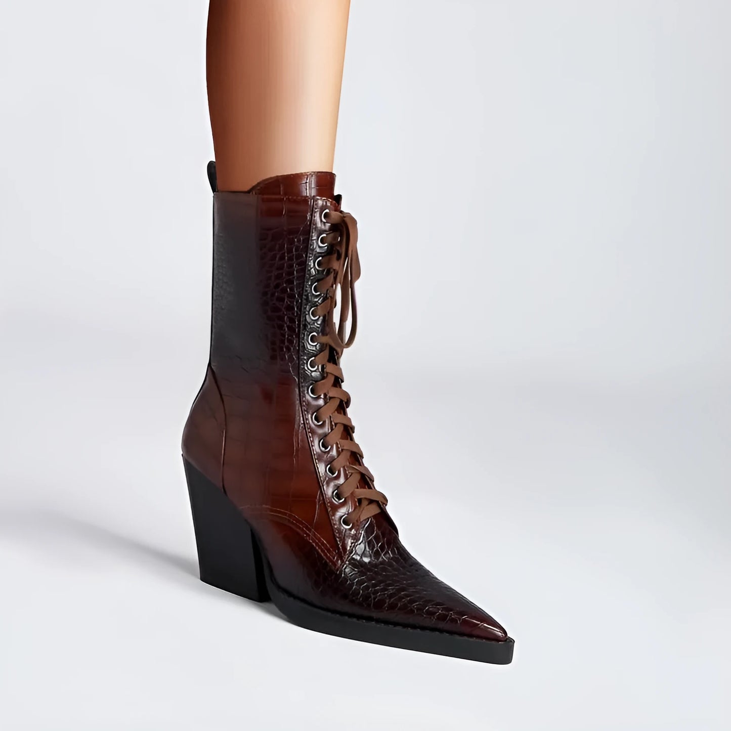 Dark brown women's ankle boots with a chunky heel, pointed toe, side zipper, and a retro stone pattern on the microfiber upper.