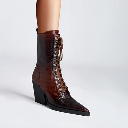 Dark brown women's ankle boots with a chunky heel, pointed toe, side zipper, and a retro stone pattern on the microfiber upper.