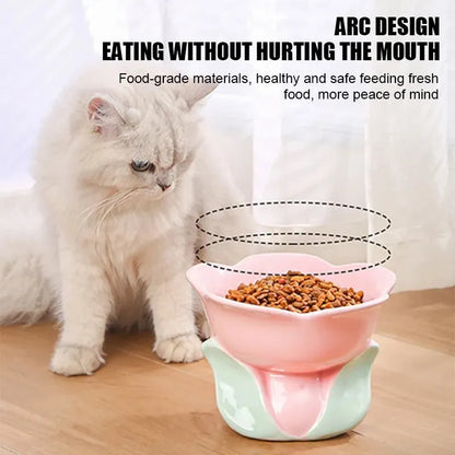 Blue ceramic raised pet bowl with floral pattern and non-slip base for cats or small dogs.