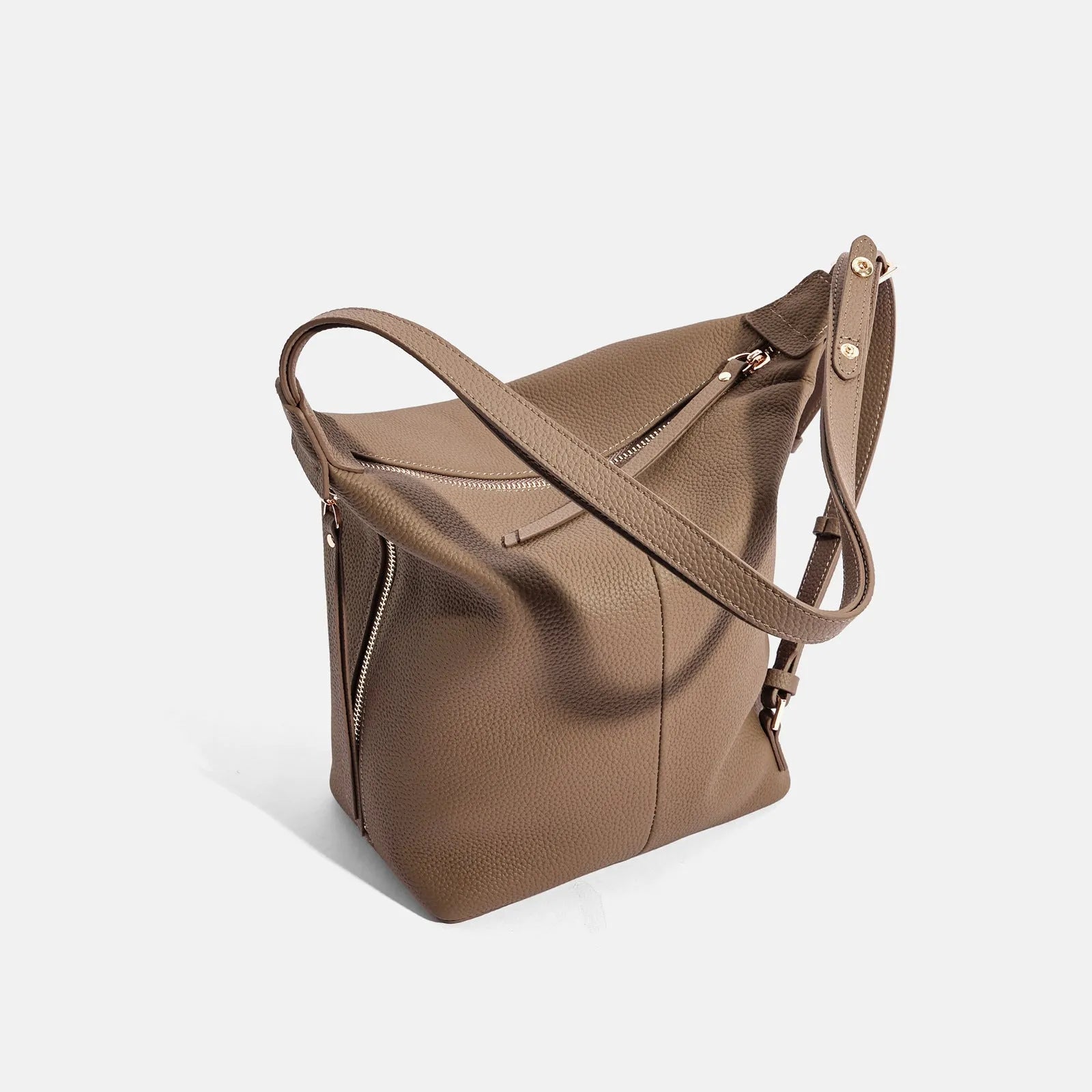 Women's genuine cowhide leather bucket bag in elephant grey colour showing soft texture and large capacity design